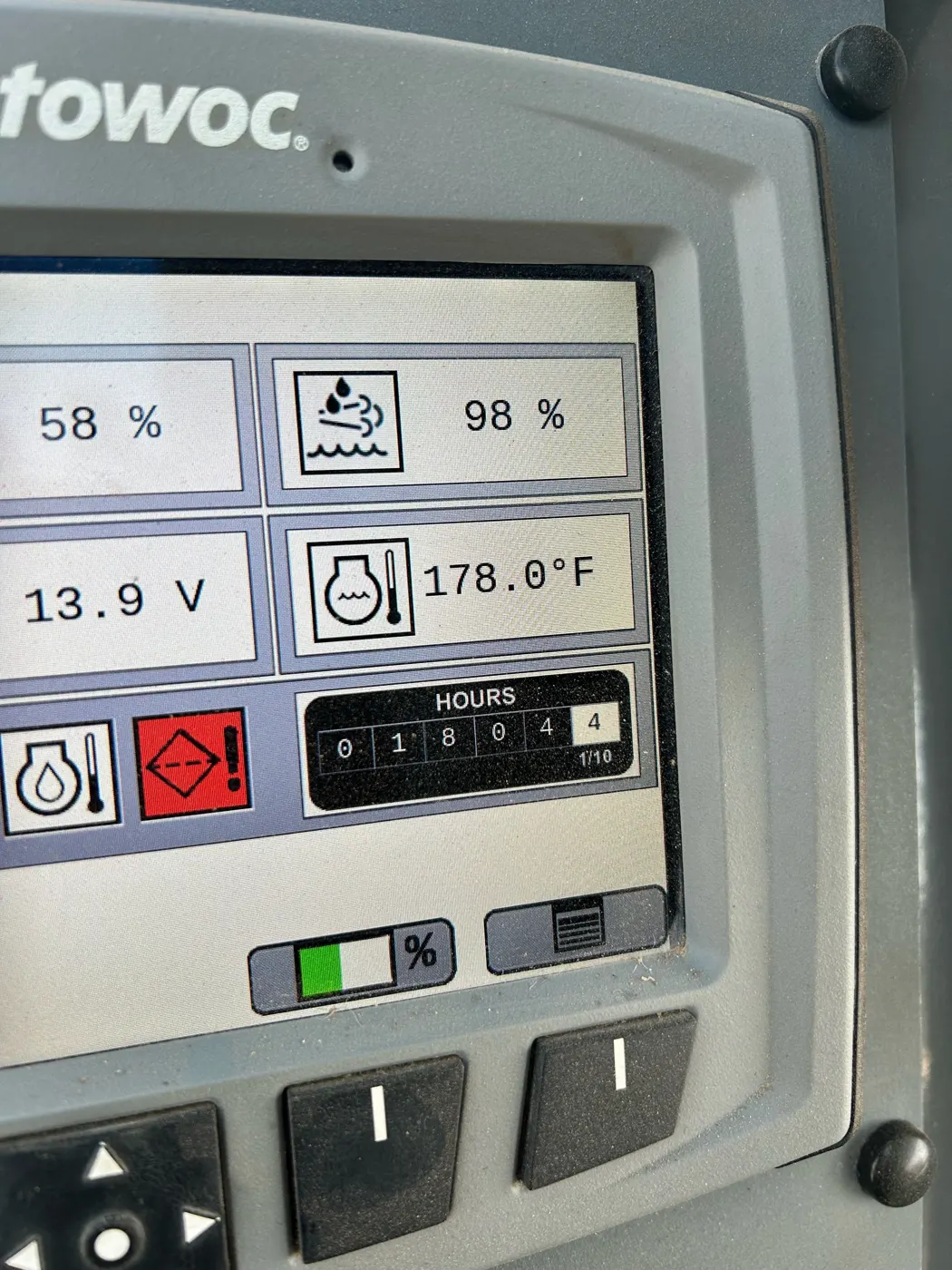 Crane operator display showing fuel level, voltage, temperature and engine hours