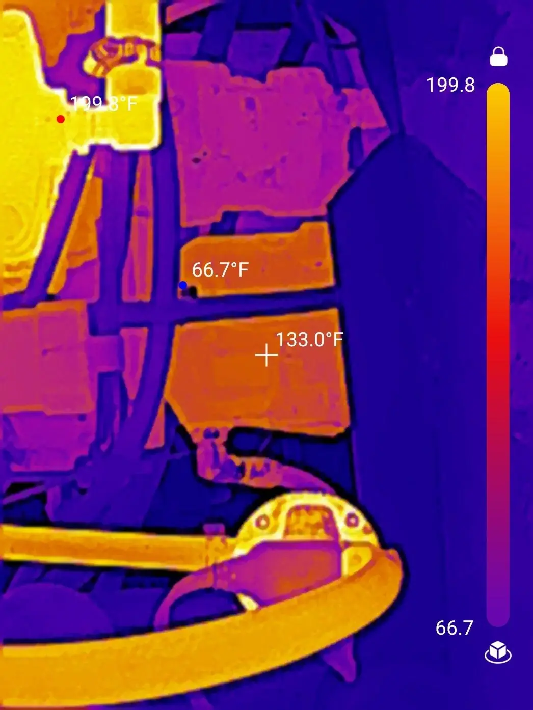 Thermal-camera view of machinery with temperature readings